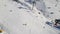 Panoramic aerial drone scenic view at ski slopes, mountain skiing and popular resort town. Italian ski resort in Alps in