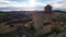 Panoramic aerial drone view of old medieval tower and castle wall of old Benabarre castle and view of surrounding area