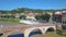 Panoramic aerial drone view of Verona, Italy. The drone moves away from the bridge Ponte Pietra and view  of the car traffic