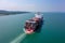 Panoramic aerial front view of a cargo ship carrying containers for import and export, business logistic and
