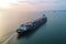 Panoramic aerial front view of a cargo ship carrying containers for import and export, business logistic and