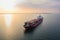 Panoramic aerial front view of a cargo ship carrying containers for import and export, business logistic and