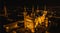 Panoramic aerial shot at night time of illuminated Basilica Notre Dame de Fourviere - Lyon