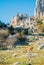 Panoramic aerial top view of mountains stones of El Torcal natural park,a lot of trees and wild goat greezing near the path on