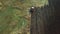 Panoramic aerial view of agricultural cultivated field with tractor performing fall tillage