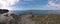 Panoramic aerial view of Asinara Island with the old Pelosa Tower  surrounded by turquoise seawater