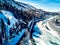 Panoramic aerial view: beautiful spring landscape: the Ulba river in Kazakhstan wakes up from winter sleep - ice drift - snow and