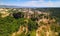 Panoramic aerial view of Civita di Bagnoregio from a flying drone around the medieval city, Italy