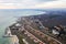 Panoramic aerial view of the cottage settlement by sea. Top view of the marine cottage village, line of strengthening the coast in