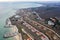 Panoramic aerial view of the cottage settlement by sea. Top view of the marine cottage village, line of strengthening the coast in