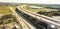 Panoramic aerial view elevated expressway through water zone and construction site