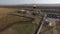 Panoramic aerial view on flare stack and oil and gas station in field