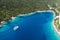 Panoramic aerial view of Foki Beach and sailing yacht boats moored in turquoise bay. Fiskardo, Kefalonia island, Greece