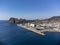 Panoramic aerial view on historical coastal Provencal city La Ciotat with large sailboat harbour and yacht shipyard, summer