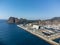 Panoramic aerial view on historical coastal Provencal city La Ciotat with large sailboat harbour and yacht shipyard, summer