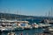 Panoramic aerial view on historical coastal Provencal city La Ciotat with large sailboat harbour and yacht shipyard, summer