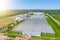 Panoramic aerial view of the large glass greenhouse for the cultivation of vegetable crops and flowers