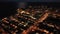 Panoramic aerial view of lighted Oropesa del Mar by Mediterranean coast in twilight, Plana Alta, Spain