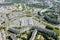 Panoramic aerial view of modern residential neighborhood, road intersection, shopping malls and parking lots