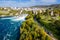 Panoramic aerial view of Rhine Falls and cityscape of Neuhausen am Rheinfall town, Switzerland. Red Swiss train, and tourist boats