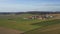 Panoramic aerial view of rustic village in agrarian countryside