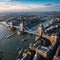 Panoramic aerial view of the skyline of London with the lifted Tower Bridge and a cruise ship passing under made with