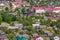 panoramic aerial view of a small urban-type settlement with red roofs