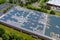 Panoramic aerial view solar panel energy on the an industrial warehouse