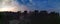 Panoramic aerial view of sunrise above tropical rainforest