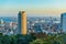 Panoramic aerial view of sunset Kobe city with modern buildings and coastline, Japan