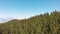 Panoramic aerial view - thick clouds in the mountains above the evergreen forest on Tenerfe, Canary Islands, Spain