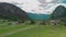 Panoramic aerial view of wooden house and barn at mountains