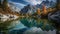 Panoramic autumn landscape, majestic mountain range, tranquil reflection lake generated by AI