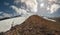 Panoramic background of volcanic rocks of stones and a glacier cascading from the northwest side of Mount Elbrus