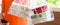 Panoramic banner image of Asian food boxes in plastic bags delivered to customer at home