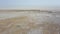 Panoramic beautiful top view from above of the Maranjob desert. The drone slowly moves away from the dried-up salt lake Namak.