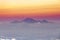 Panoramic beautiful view on theRinjani volcano, Lombok, from top og the volcano Agung. Gradient purple pink yellow hazy horizon at