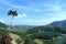 Panoramic Beauty From Panca Warna Peak: Lake, Mountains, and Distant City