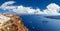 Panoramic bird eye aerial view of white building, blue sky and vivid sea in Santorini island, Oia, Greece