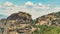 Panoramic bird's eye perspective over Meteora monasteries in Greece. Nature combined with human-built architecture.