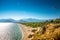 Panoramic bird view of Antalya and Mediterranean seacoast and beach with a paraglider, Antalya, Turkey