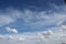 Panoramic Blue summer sky with white easy feather clouds