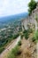 Panoramic breathtaking view from Mystras hill with ruins of medieval Villehardouin`s Castle to modern city Mystras and valley