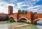 Panoramic cityscape aerial view on Verona historical center, bridge and Adige river. Famous travel destination in Italy. Old town