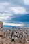 Panoramic cityscape view on Greece capital Athens city from Acropolis hill. View through ancient ruined stones on straight street