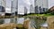 The panoramic cityscape views and architectural details, lake grass and high rise buildings