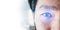 Panoramic close-up Asian businessman`s eye , with futuristic technology visual effect