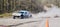 Panoramic closeup shot of a Trophy truck flat out on a dusty track at Walters arena, United Kingdom