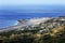 Panoramic coastal view over the international airport of madeira, green succulents in front