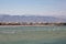 Panoramic coastline view of town of Sur, Oman with mountains in background